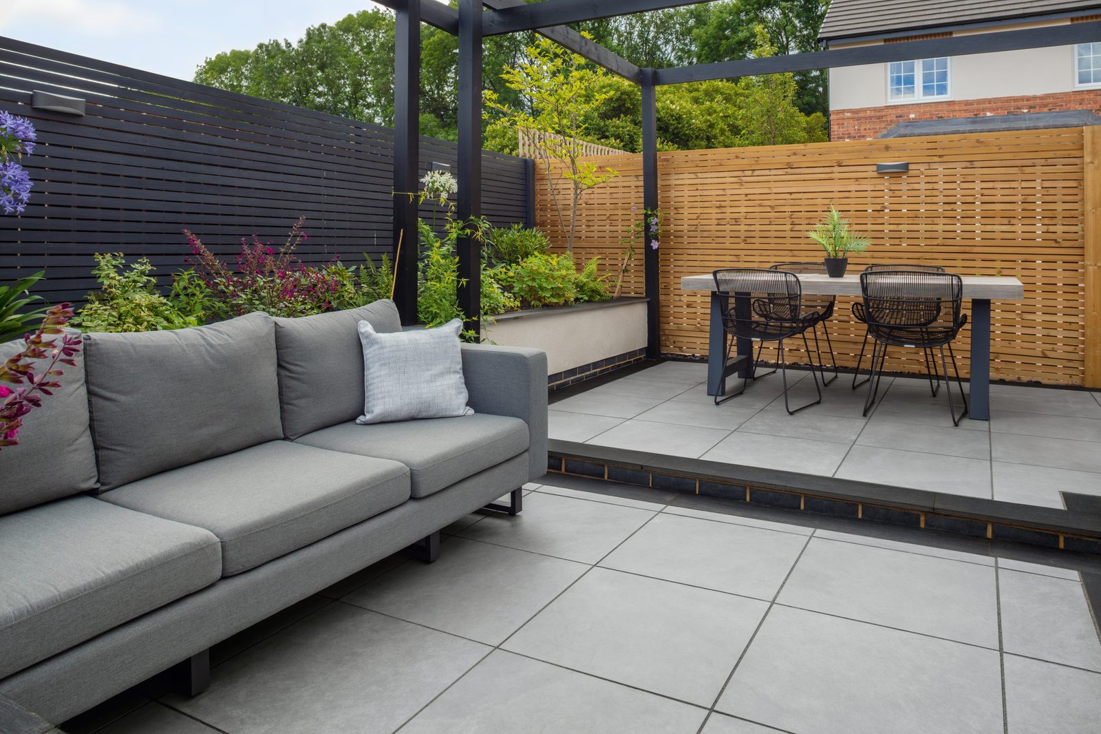 Natural stone patio landscaping with borders
