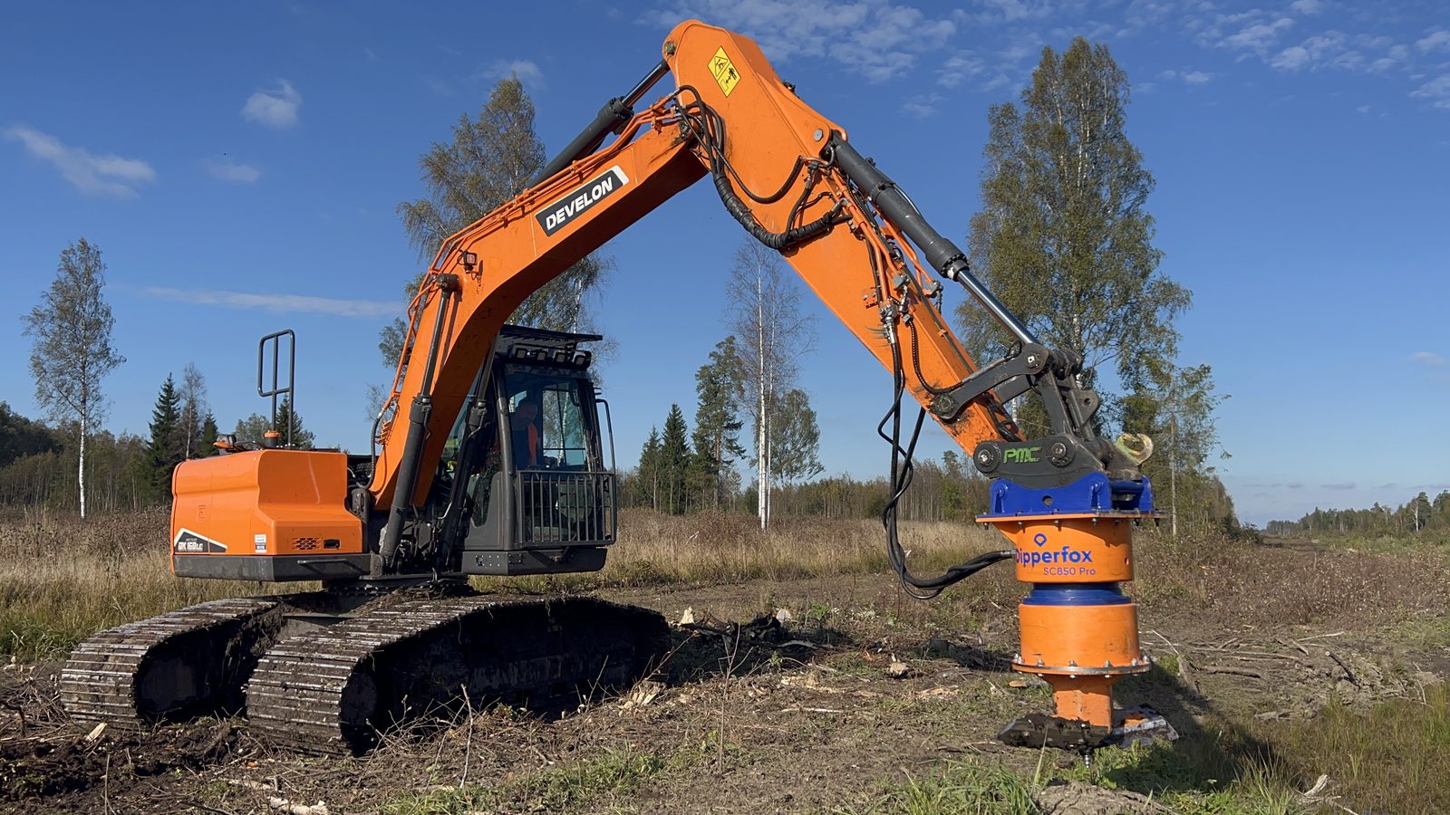 Stump grinding machine removing a tree stump